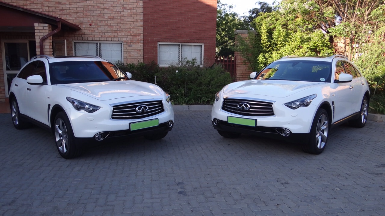 two white Bulletproof Infiniti F35s