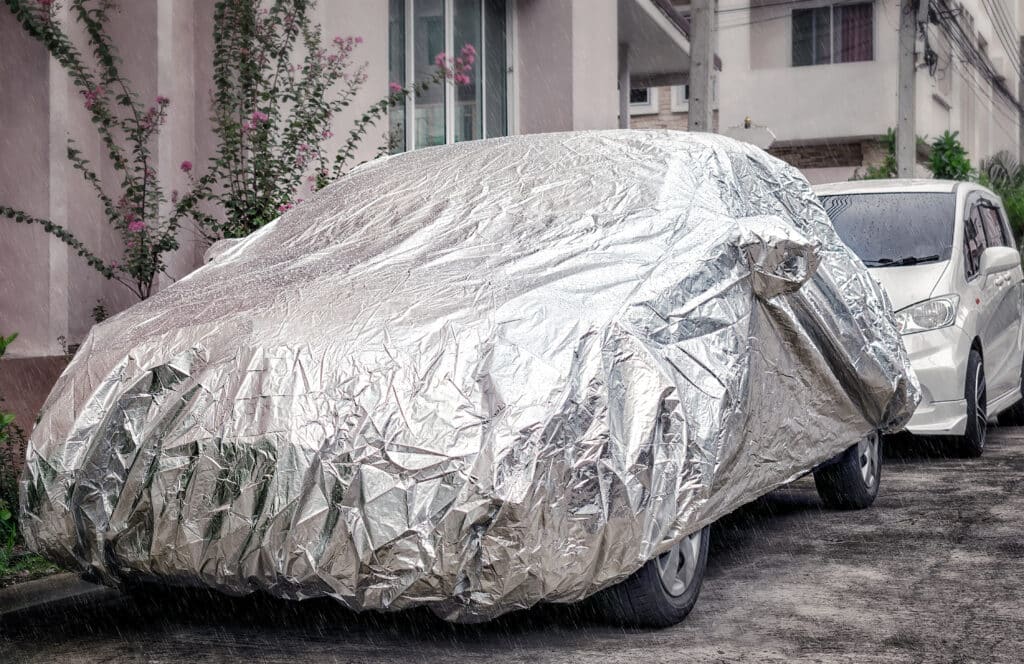 Weather Proof Car Cover Protects Vehicle from Rain.