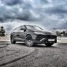 Armormax armored Lamborghini Urus bulletproof luxury SUV driving on road in Utah with mountain backdrop.