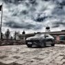 Armormax armored Lamborghini Urus bulletproof luxury SUV driving on road in Utah with mountain backdrop.